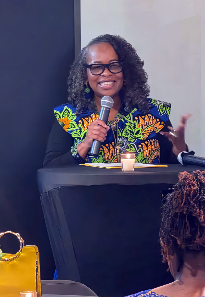 Nina S. Jones speaking at an empowerment conference